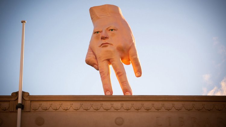 GIANT FACE-HAND” by Ronni Van Hout installed on roof in Wellington